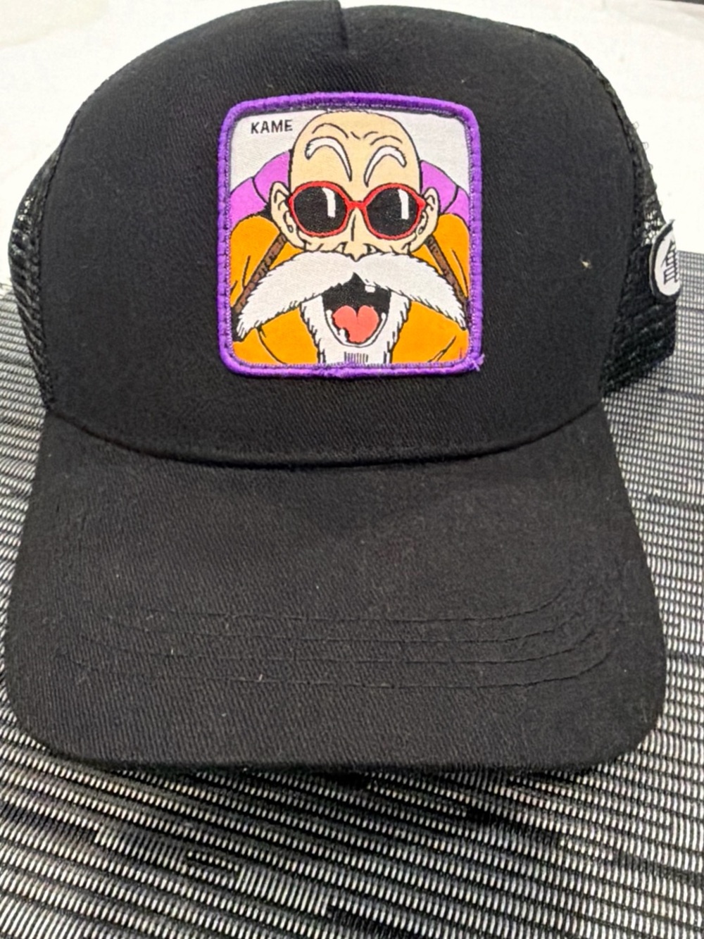Black Graphic Trucker Hat with Colorful Patch
